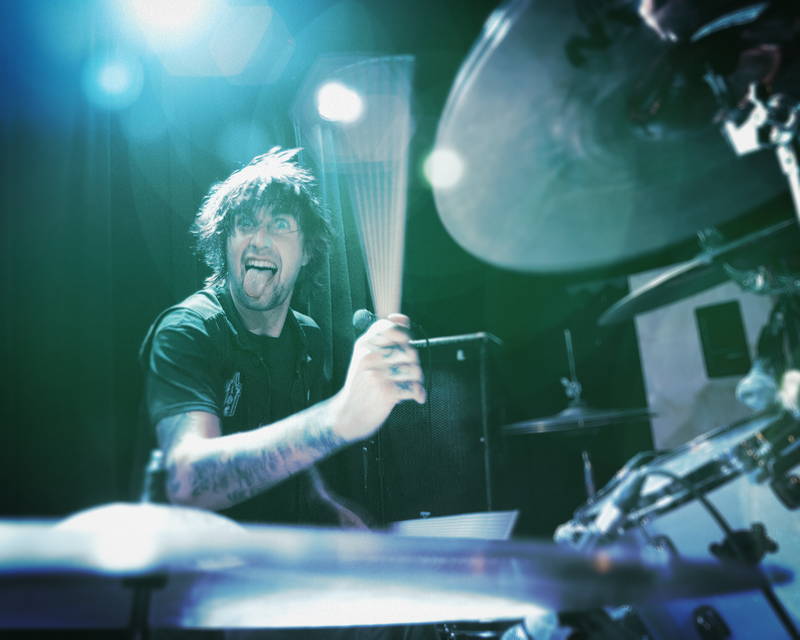 Rock band drummer onstage at music festival. Stock Photography Free for Commercial Use.