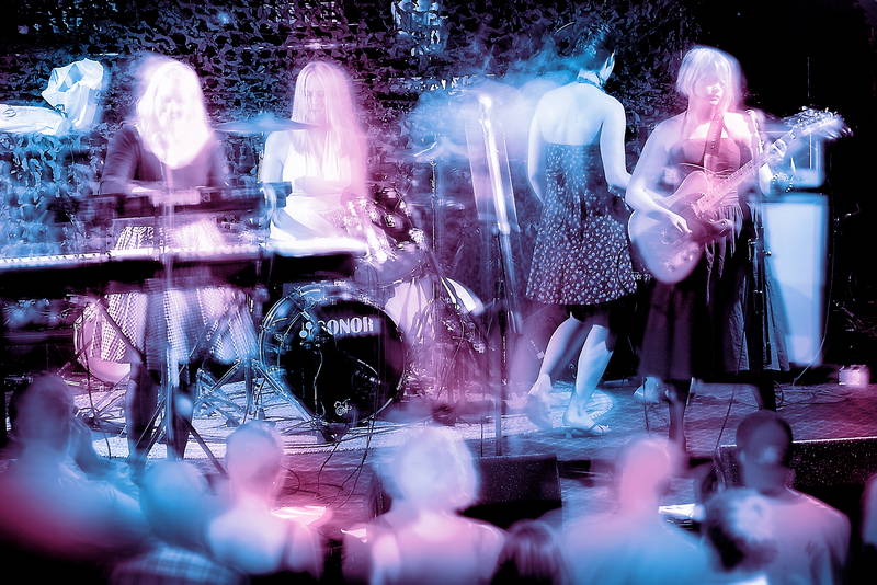 All girls rock band onstage at music festival. Stock Photography Free for Commercial Use.