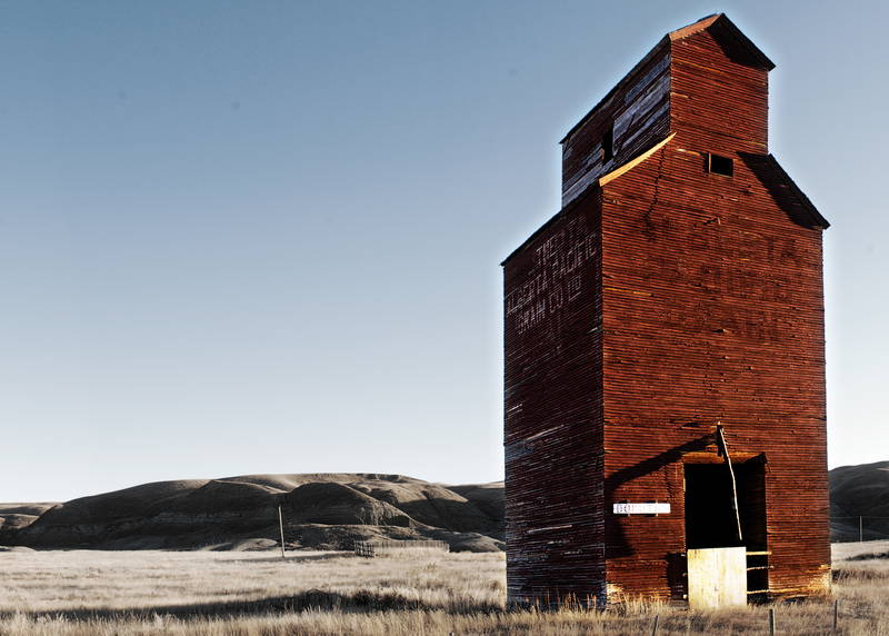 Grain elevator in the frost below the foothills. Stock Photography Free for Commercial Use.