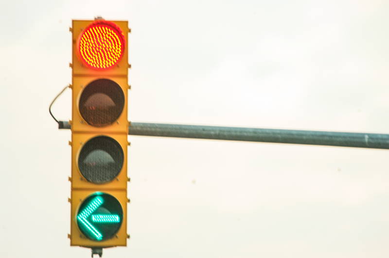Traffic light on advanced left hand turn. Stock Photography Free for Commercial Use.